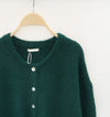 Detail van groen vest – Premium stof voor een luxe pasvorm.