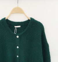 Detail van groen vest – Premium stof voor een luxe pasvorm.