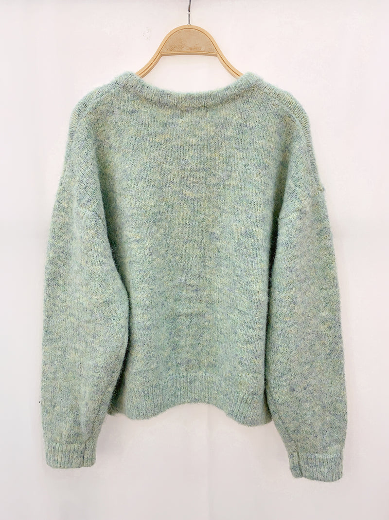 Mintkleurig vest met knopen, perfect te combineren met zowel casual als chique outfits.