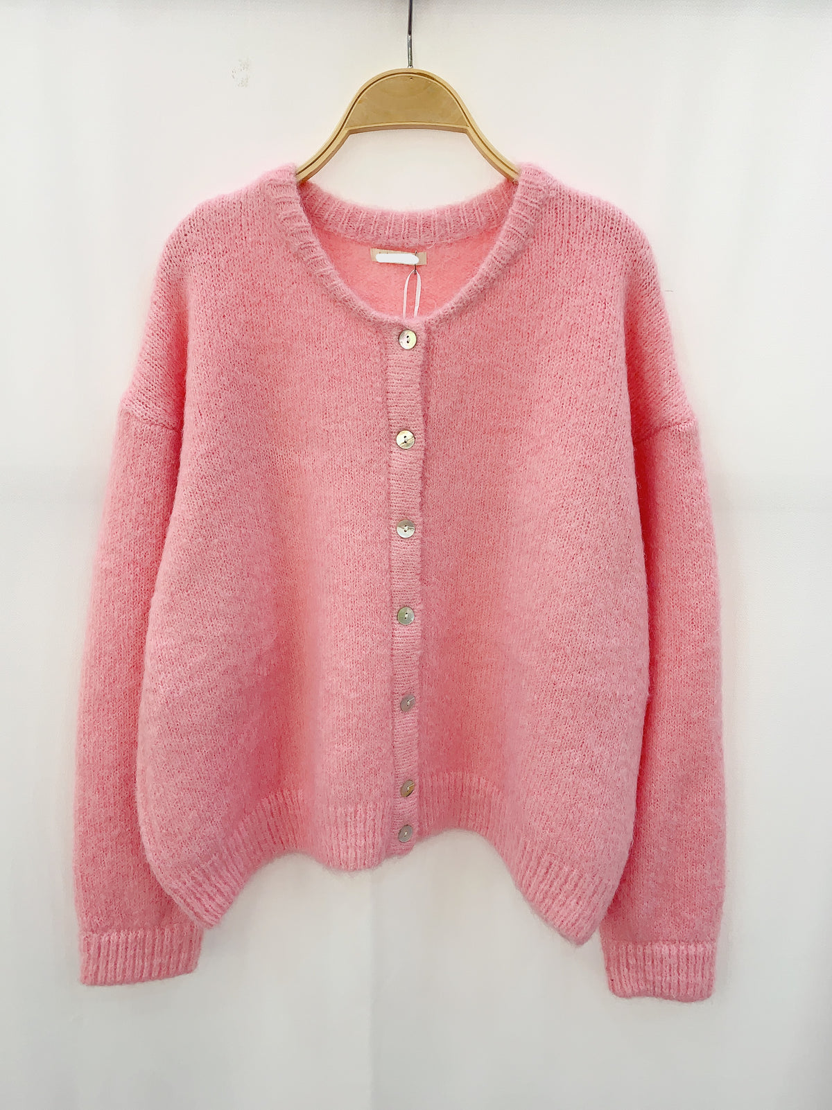 Elegante roze vest met knopen van premium stof voor luxe en comfort, ideaal voor elke gelegenheid.