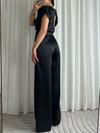 Zwarte jumpsuit met korte mouwen – ideaal voor een avond uit
